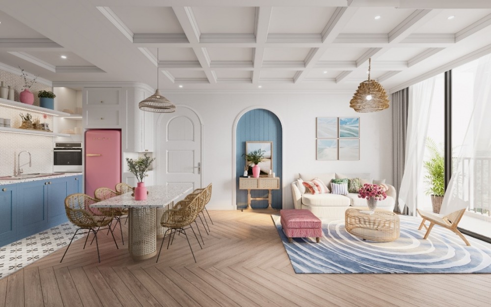 Thiết kế liên hoàn giữa phòng bếp, phòng ăn và phòng khách trong diện tích 26m2 giúp căn hộ trở nên rộng, thoáng. Lựa chọn thêm phong cách nội thất hiện đại với màu sắc chủ đạo là trắng và hồng, xanh pastel sẽ làm không gian trở nên vô cùng tươi mát, dễ chịu.